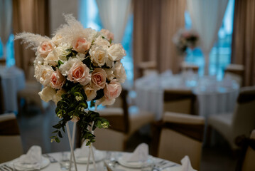 Flower decoration for celebrations. Decoration of tables and chairs. Rustic decoration.

