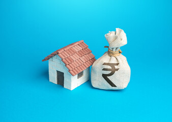 House and indian rupee money bag. Real estate investment. Property value appraisal. Make a deal....