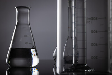 Close up of laboratory dishes and copy space on grey background