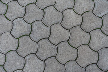 Backdrop - rounded gray concrete interlocking paver blocks