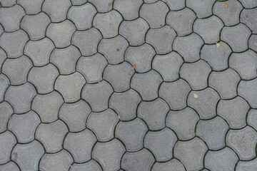 Background - rounded gray concrete interlocking paver blocks - obrazy, fototapety, plakaty