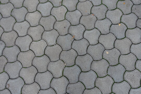 Background - rounded gray concrete interlocking paver blocks