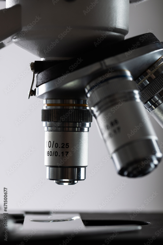 Aufkleber vertical image of laboratory microscope and copy space on grey background