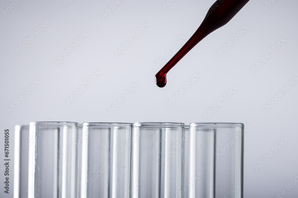 Poster close up of laboratory test tubes and pipette with copy space on white background