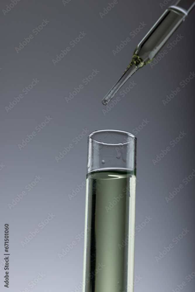 Aufkleber vertical image of close up of laboratory test tube and pipette with copy space on grey background