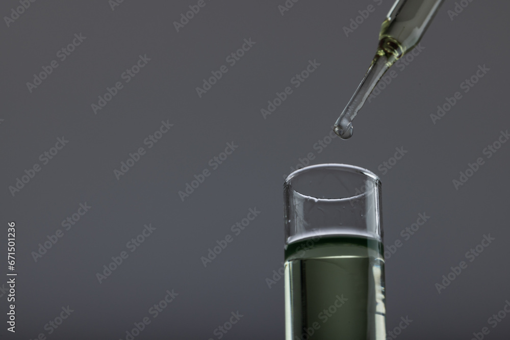 Aufkleber vertical image of close up of laboratory test tube and pipette with copy space on grey background