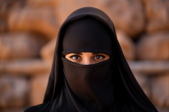 Middle Eastern woman wearing niqab, only eyes visible