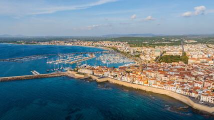 Aerial view of the old town of Alghero in Sardinia. Photo taken with a drone on a sunny day....