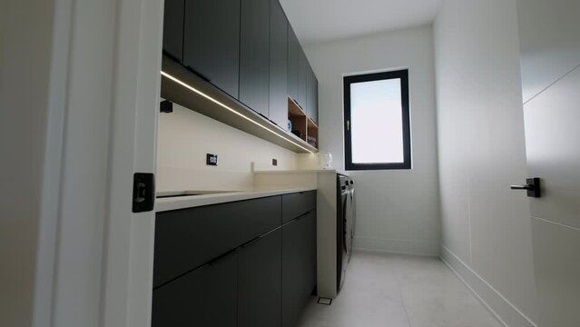 Modern Laundry room in house. Move camera wide shot