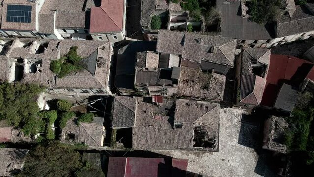 Drone view of an old abandoned ghost town and houses with destroyed roofs. Village of old Apice (Borgo di Apice Vecchia)