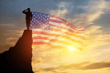 USA army soldier saluting on a background of USA flag. Greeting card for Veterans Day, Memorial Day, Independence Day.