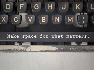 Motivational and inspirational wording. MAKE SPACE FOR WHAT MATTERS written on a typewriter spacebar. With blurred styled background.