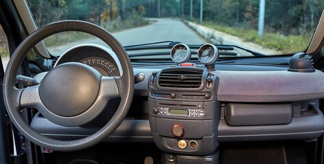 Car steering wheel and interior background, modern city car elements close view. Car inside interior