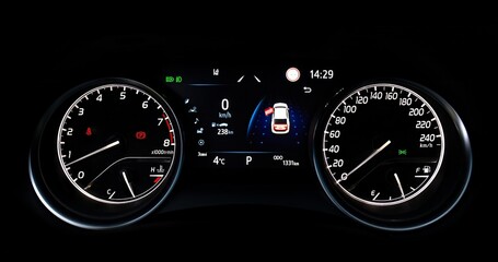 Car speedometer and sensors on a control panel background, car elements close view