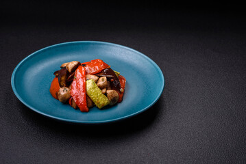 Delicious salad of grilled vegetables tomatoes, mushrooms, sweet peppers, eggplants