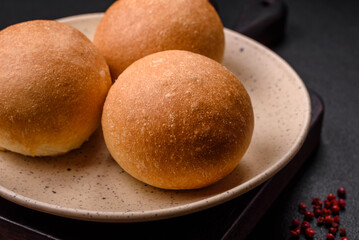 Delicious fresh crispy white round bread with seeds and grains