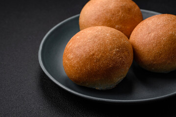 Delicious fresh crispy white round bread with seeds and grains