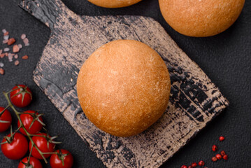 Delicious fresh crispy white round bread with seeds and grains