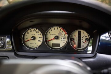 Car steering wheel and car sensors, inerior background, modern city car elements close view. Car...