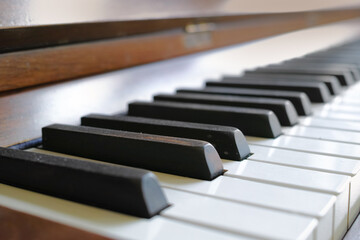 Closeup of a vintage piano and keyboard for music. Zoom in on an antique and classic musical...