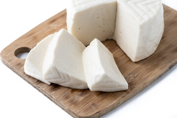 Fototapeta na wymiar Sliced fresh white cheese from cow's milk isolated on white background