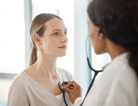 Doctor listening to stethoscope heartbeat, patient breathing and lungs for healthcare checkup, test and consulting in hospital. Woman with medical screening from cardiology physician for tuberculosis