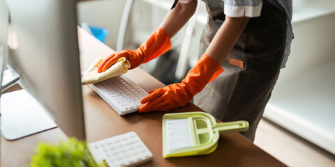 Asian woman cleaning in work room at home. Young woman housekeeper cleaner use a cloth to wipe equipment for working. concept housekeeping housework cleaning - obrazy, fototapety, plakaty