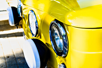 Detail of the headlights of an old car, classic, retro vehicle - obrazy, fototapety, plakaty