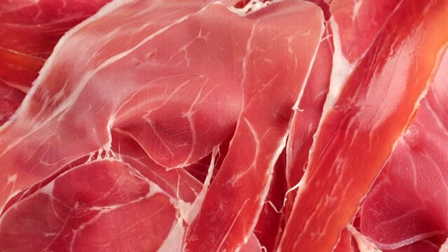 Zoom frame Jamon Serrano or Iberico macro, rotation. Spanish ham pork for tapas