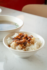 Braised meat over cooked rice, famous and delicious street food in Taiwanese restaurant.