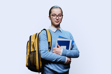 Portrait of teenage girl high school student on white background