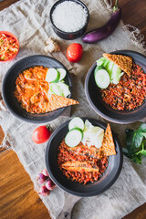 Hot plate or Sambal Gami is Traditional food from Indonesia. Served on plate with a bowl of rice and vegetables top view. Super hot and spicy food