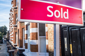 Estate agent Sold sign on residential street south west London