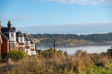 Dorking, Surrey - UK: Early morning low cloud below Box Hill viewed from Cotmandene in Dorking, a picturesque town in the Surrey Hills