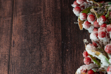  
New Year or New Year's Eve on a wooden background of fir branches, cones and amelia. The year 2024 is approaching.
