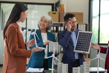 Four busy office workers listen to an African team leader take part in a group meeting in the office room. American supervisor gives advice to multi-ethnic company employees Consulting concept