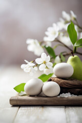 Fototapeta na wymiar Wellness background with apple tree flowers and white eggs