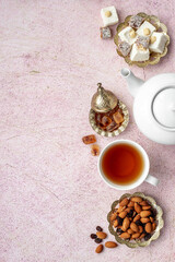 Obraz na płótnie Canvas Traditional oriental tea with Turkish delight, top view