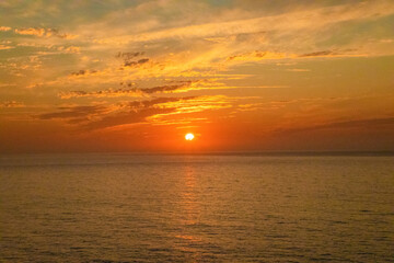 Fototapeta premium Gorgeous panorama scenic strong sunrise cloud on orange sky