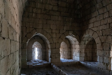 Fototapeta na wymiar A room with loopholes in the tower of the medieval fortress of Nimrod - Qalaat al-Subeiba located near the border with Syria and Lebanon in the Golan Heights, in northern Israel