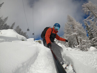 Man riding in powdre on snowborad. Freeride powder, snowboarding in alpes resort in winter....
