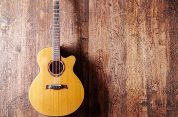 classical guitar on wooden background