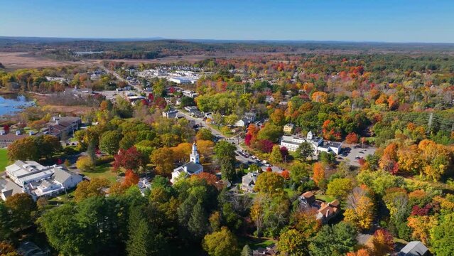 Wayland historic town center aerial view in fall with fall foliage at Boston Post Road and MA Route 27, including First Parish Church and Town Hall, Wayland, Massachusetts MA, USA. 