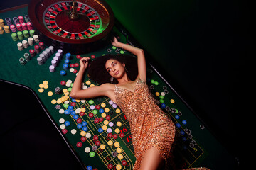 Top photo of wealthy millionaire chic girl lying poker table enjoy fortunate winning on private...