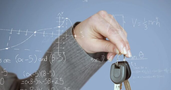 Animation of mathematical equations floating against close up of a hand hoding car keys