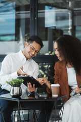 Professional investor working new start up project. Finance managers meeting.using laptop and digital tablet computer in office.