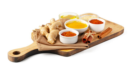 Ginger root and various spices on white background
