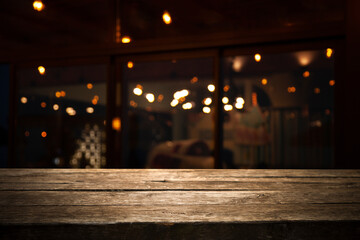 dark blurred background with empty table top, cafe restaurant windows. background for your product