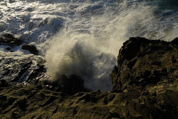 effects of waves and the ocean on the coast at sunset