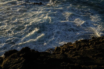 effects of waves and the ocean on the coast at sunset